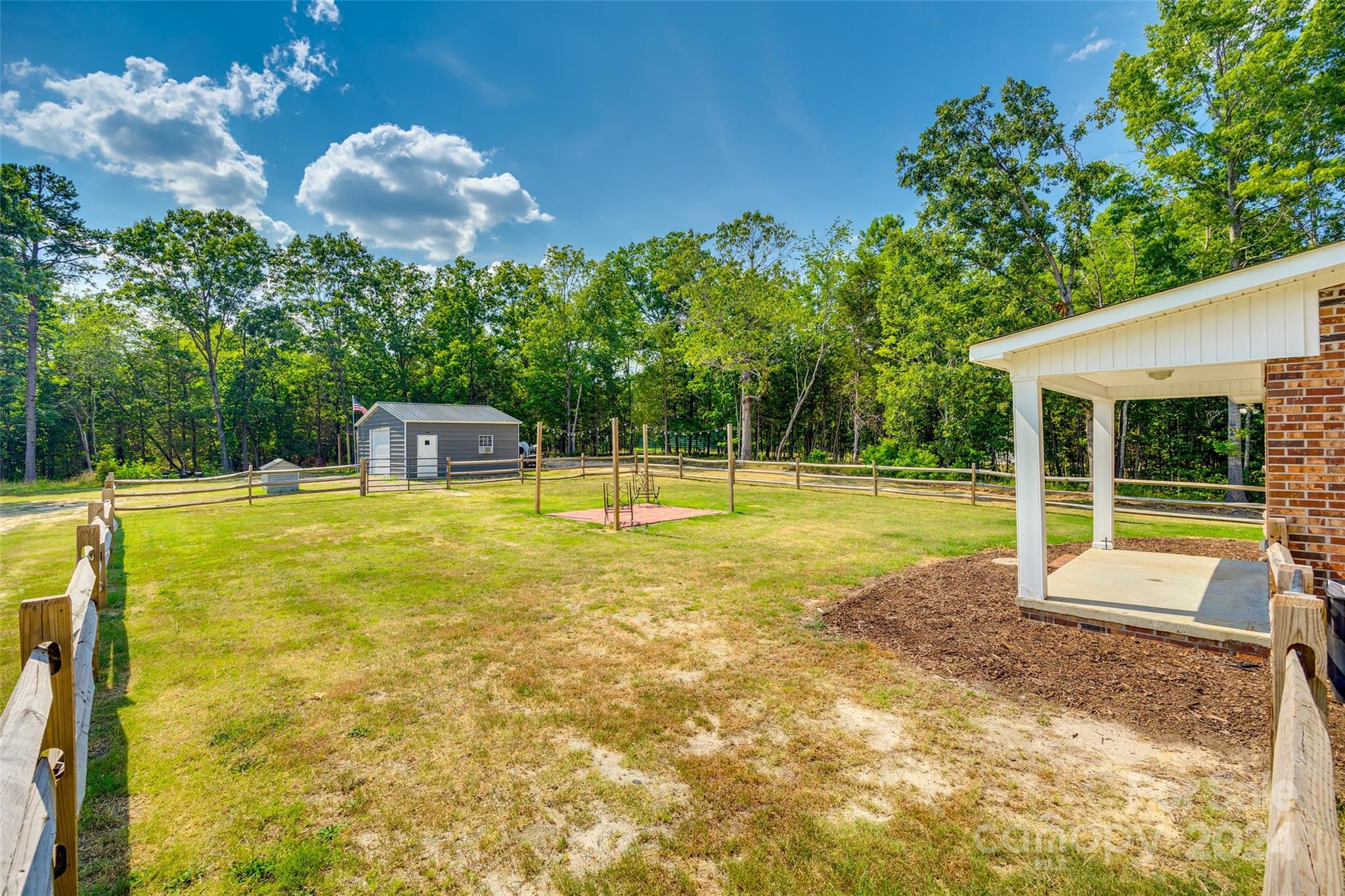 493 South Beersheba Road Clover, SC 29710 - Photo 21 of 25 a view of a swimming pool with a table and chair