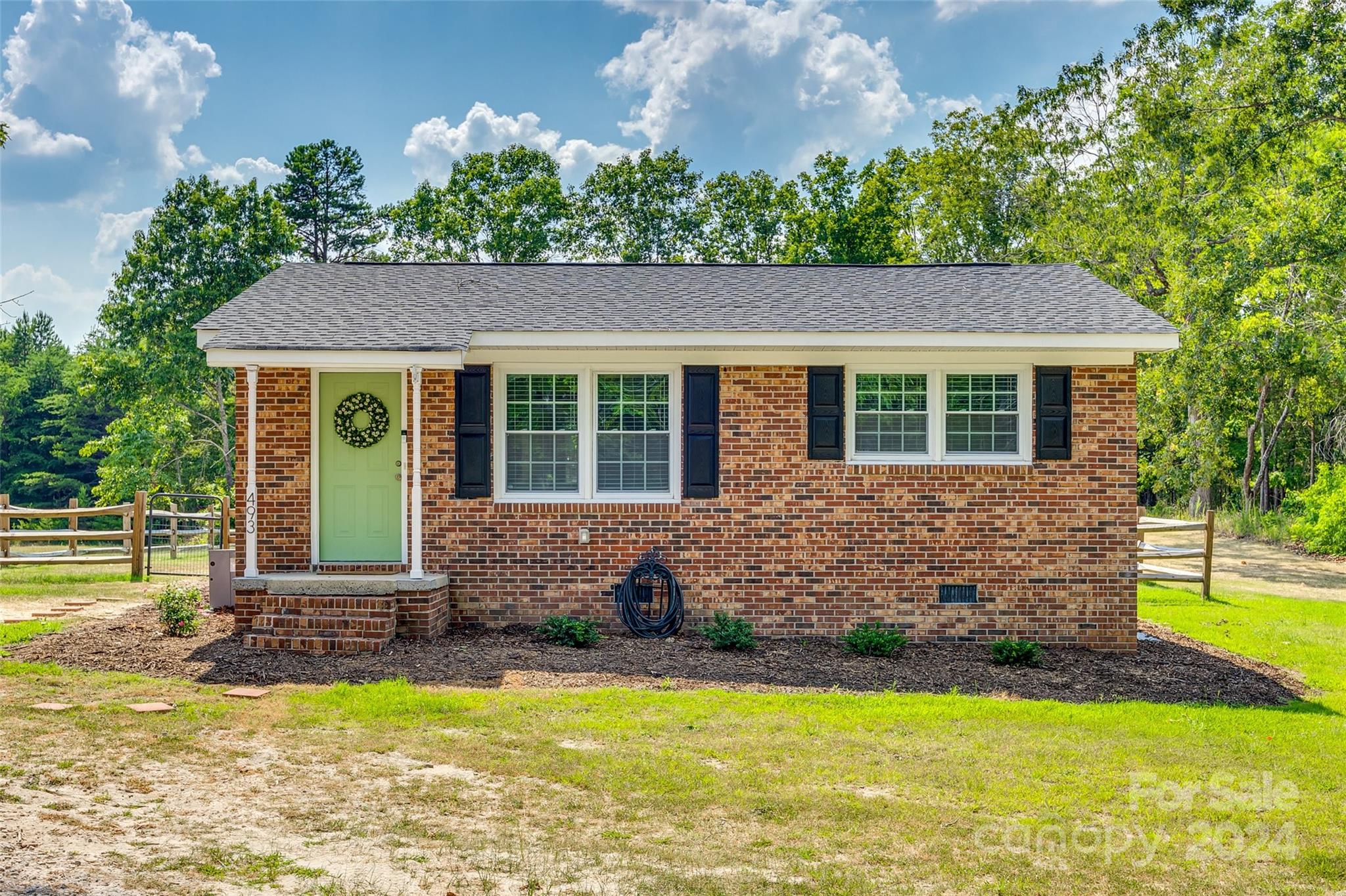 493 South Beersheba Road Clover, SC 29710 - Photo 25 of 25 a front view of house with yard and trees in the background