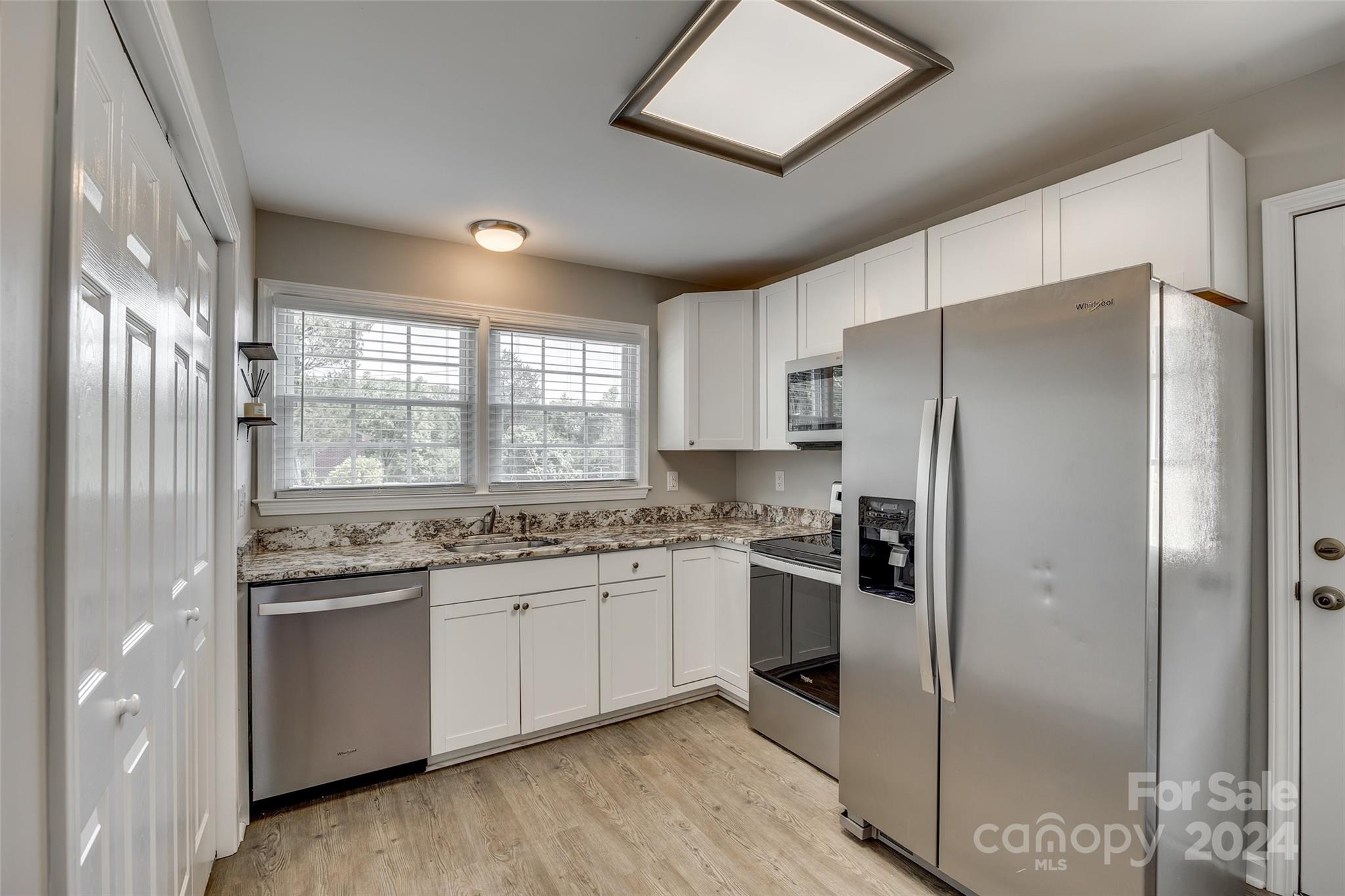 493 South Beersheba Road Clover, SC 29710 - Photo 3 of 25 a kitchen with stainless steel appliances granite countertop a refrigerator and a stove