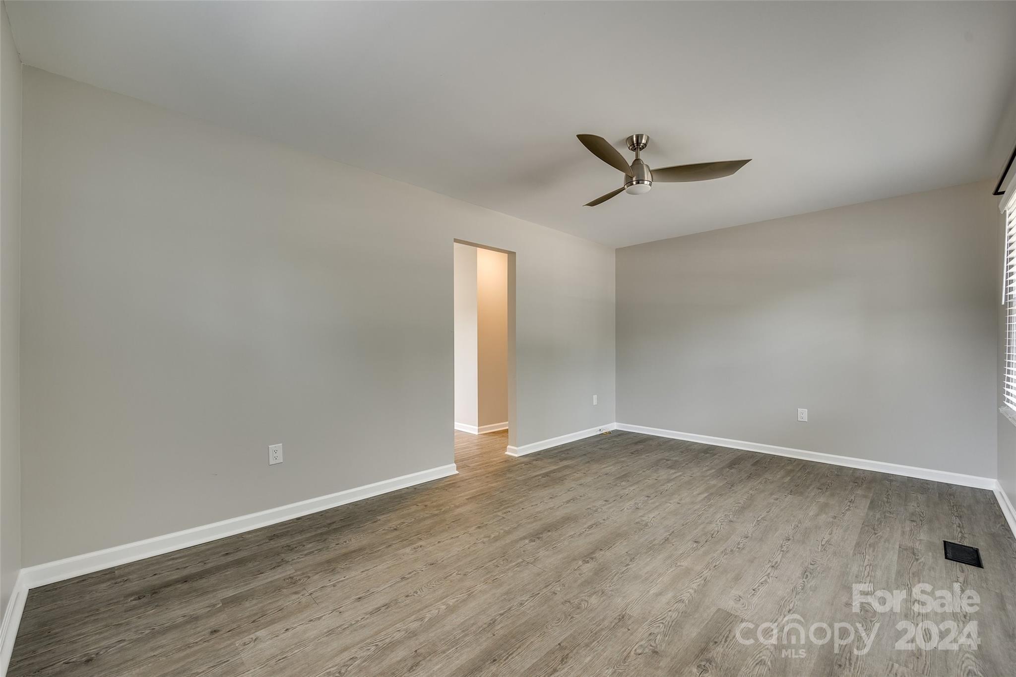 493 South Beersheba Road Clover, SC 29710 - Photo 9 of 25 an empty room with a ceiling fan and carpet