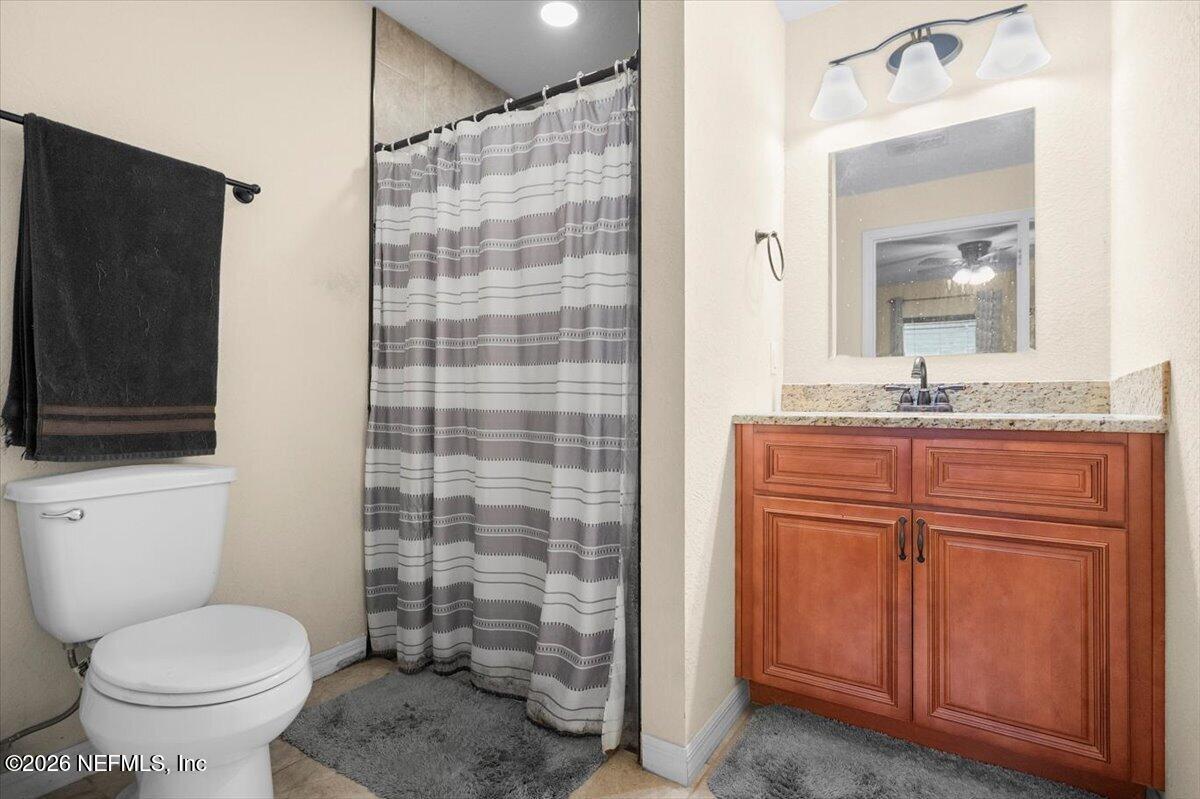 18 Pine Track Terrace Ocala, FL 34472 - Photo 14 of 23 a bathroom with a granite countertop sink toilet and shower