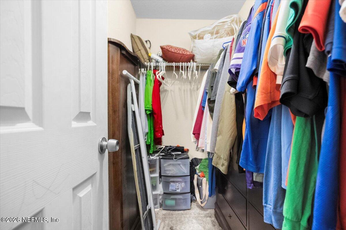 18 Pine Track Terrace Ocala, FL 34472 - Photo 15 of 23 a view of walk in closet with clothes and shoes