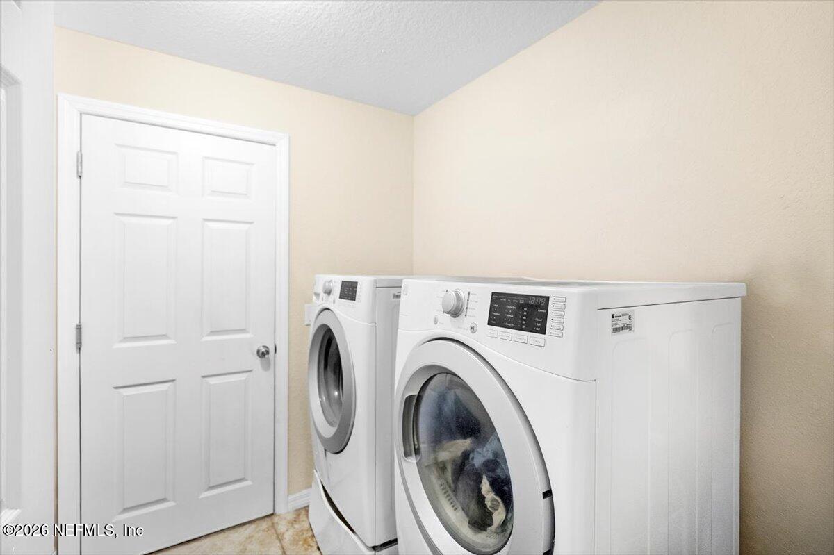 18 Pine Track Terrace Ocala, FL 34472 - Photo 16 of 23 a utility room with dryer and washer