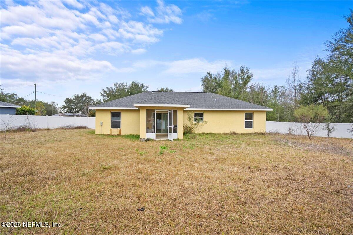 18 Pine Track Terrace Ocala, FL 34472 - Photo 21 of 23 a view of a yard in front of a house with a large tree