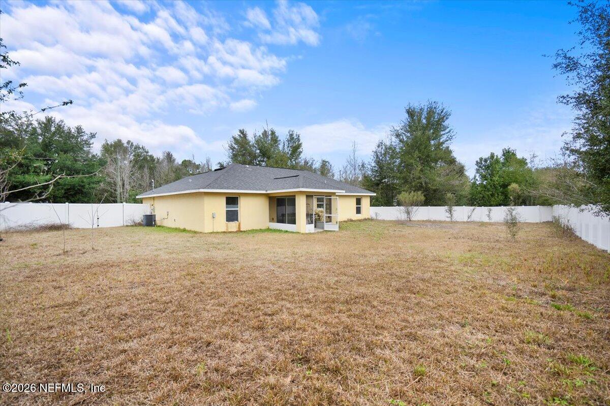18 Pine Track Terrace Ocala, FL 34472 - Photo 23 of 23 a house with trees in the background
