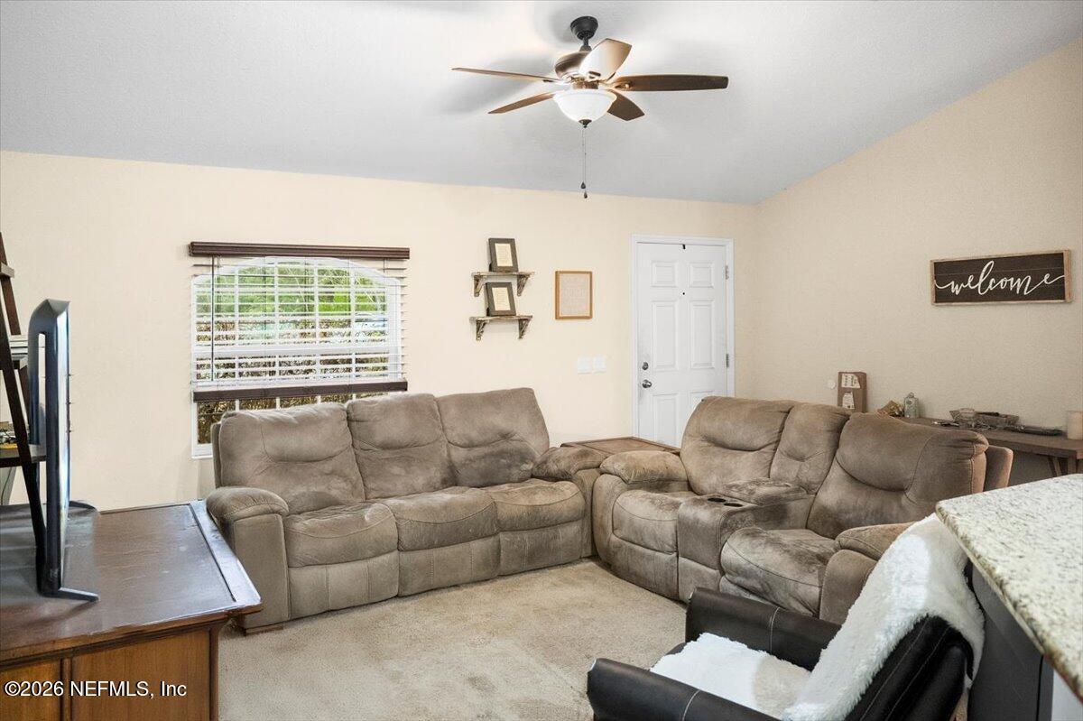 18 Pine Track Terrace Ocala, FL 34472 - Photo 5 of 23 a living room with furniture and a window
