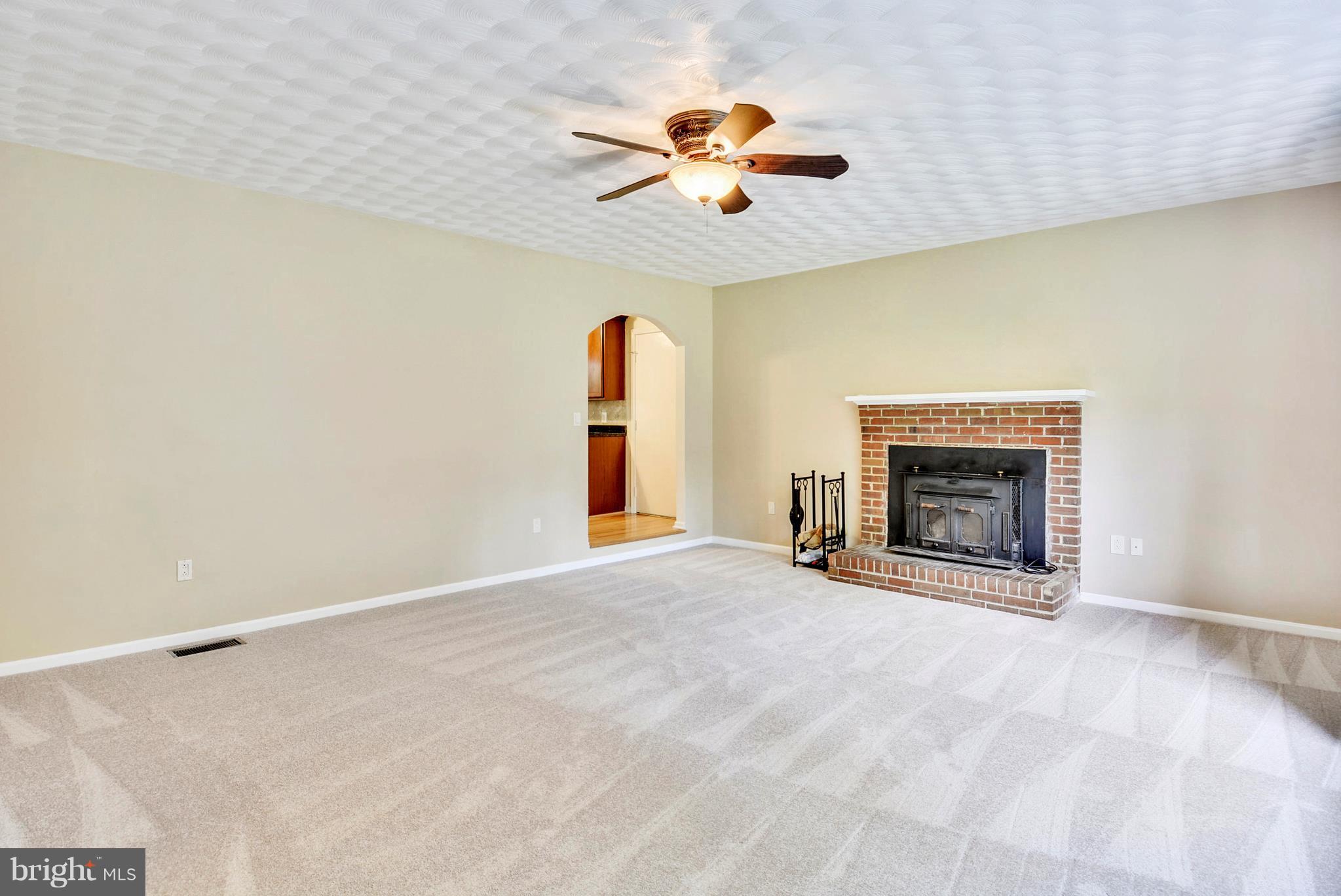 7301 Token Valley Road Manassas, VA 20112 - Photo 11 of 29 Living Room w/ Ceiling Fan & New Carpet