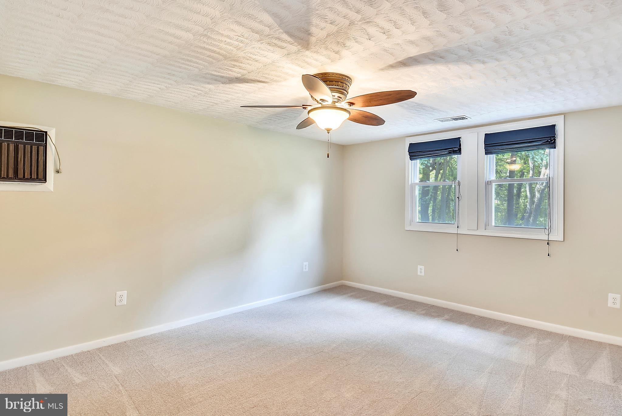 7301 Token Valley Road Manassas, VA 20112 - Photo 21 of 29 Bedroom 4 w/ Ceiling Fan & New Carpet