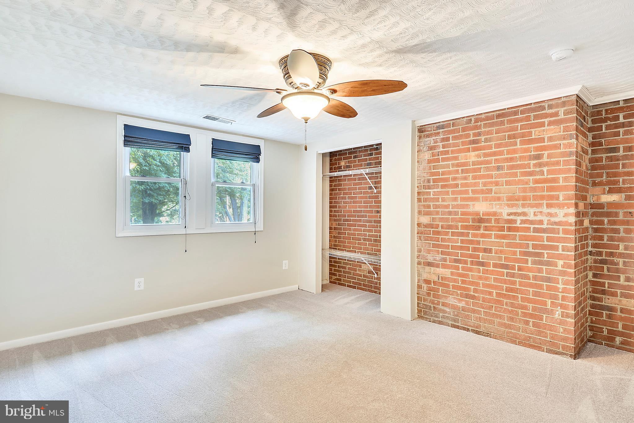 7301 Token Valley Road Manassas, VA 20112 - Photo 22 of 29 Bedroom 4 w/ Brick Wall