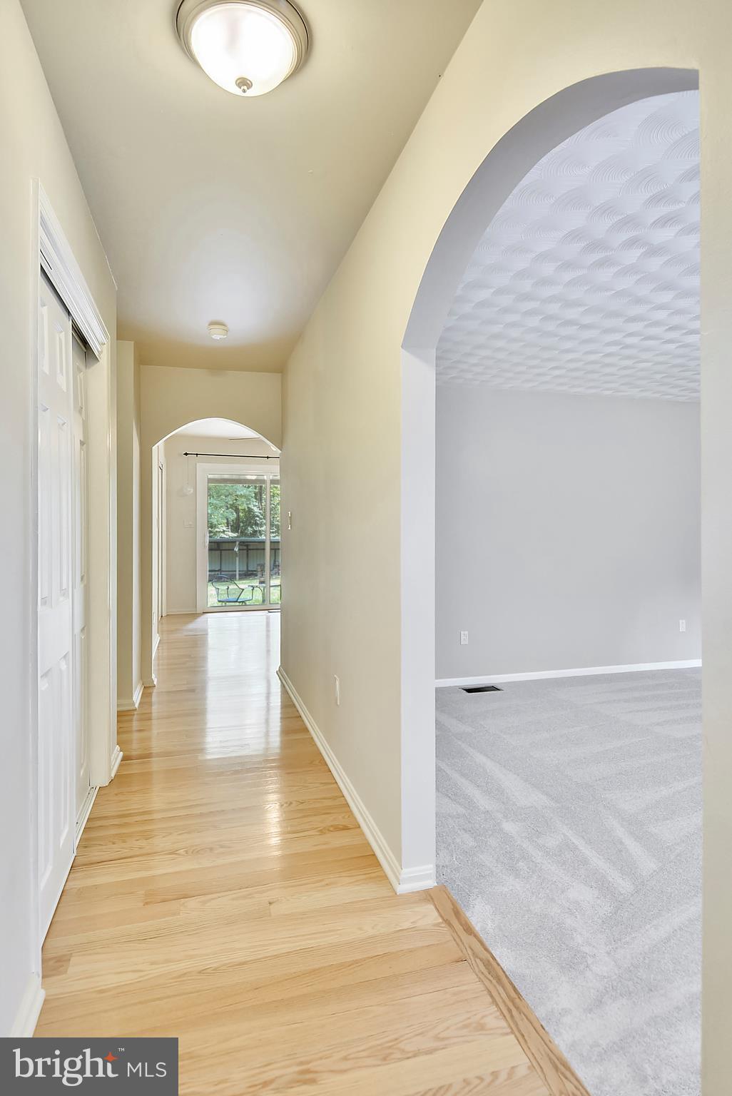 7301 Token Valley Road Manassas, VA 20112 - Photo 23 of 29 Light Filled Hallway w/ hardwood Floors