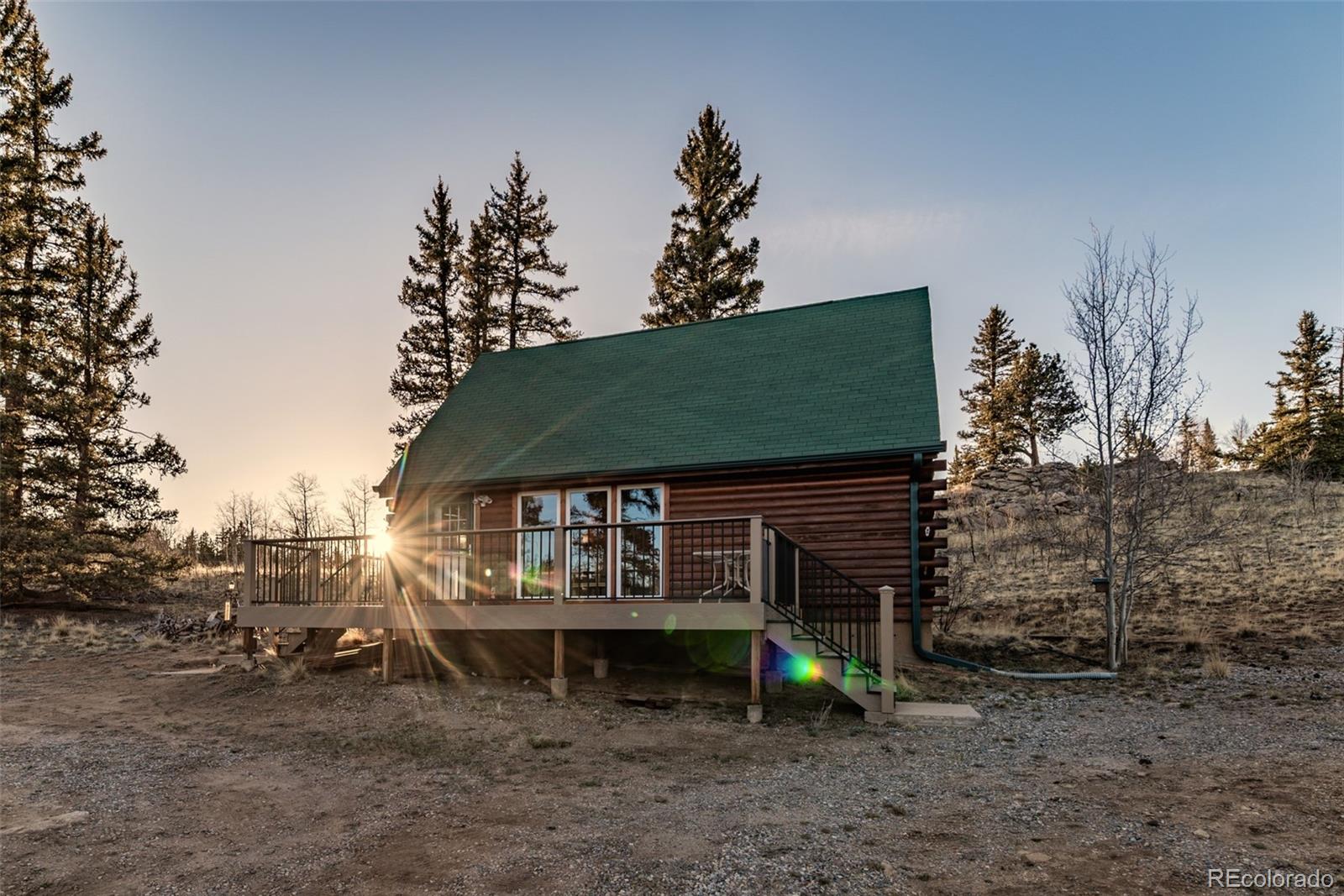 753 Teton Trail Como, CO 80456 - Photo 1 of 32 a view of a house with a yard