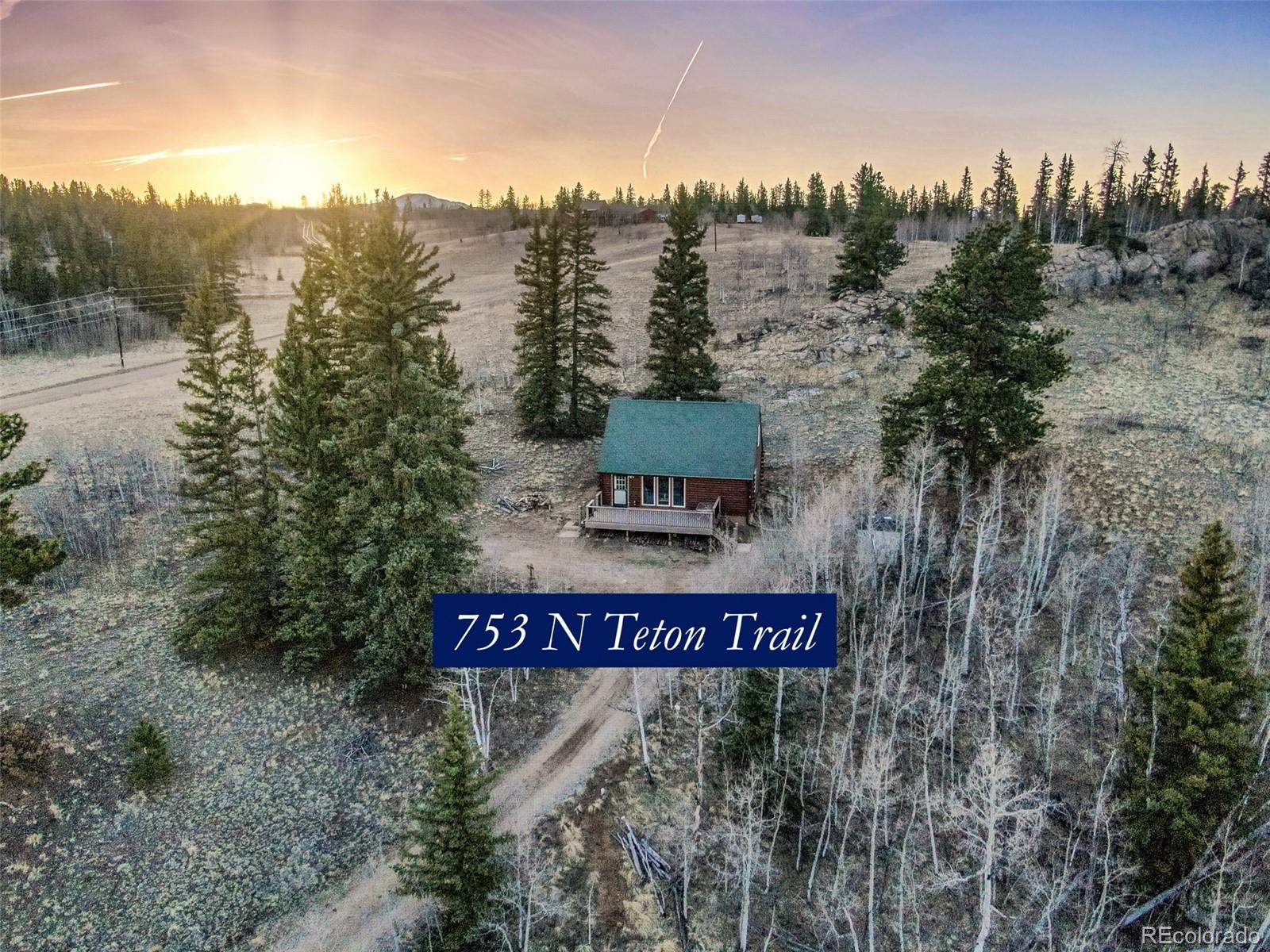 753 Teton Trail Como, CO 80456 - Photo 21 of 32 a view of a sign board with mountain and lake view