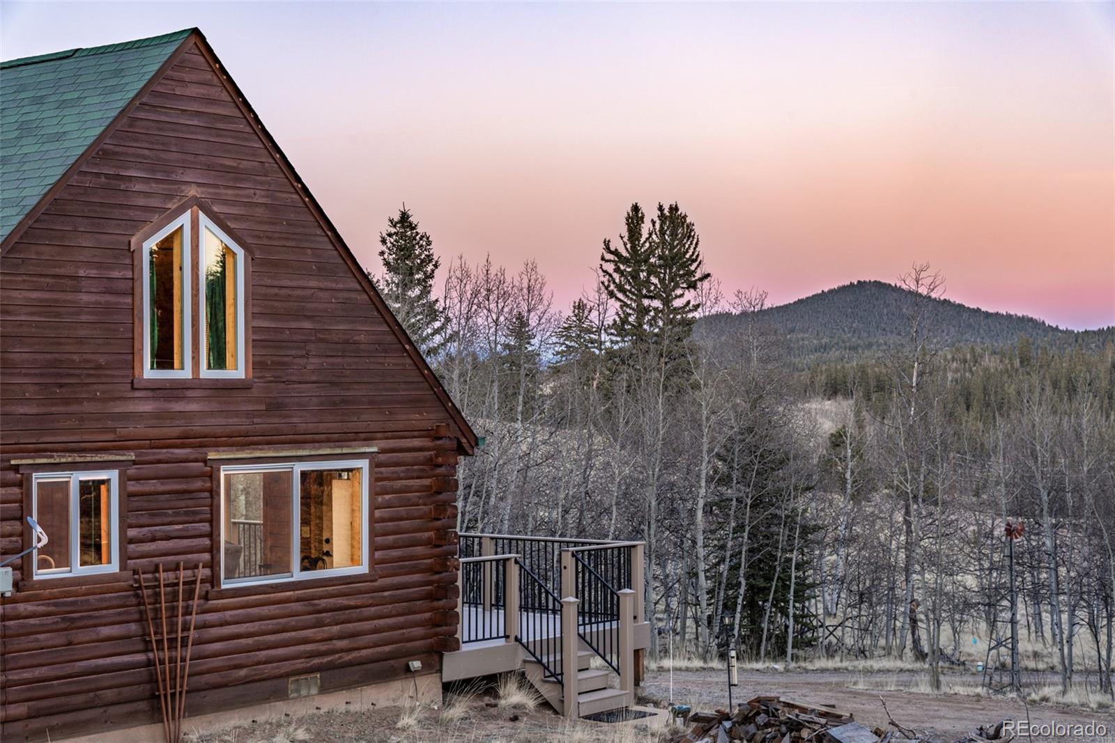 753 Teton Trail Como, CO 80456 - Photo 22 of 32 a view of a house with a yard