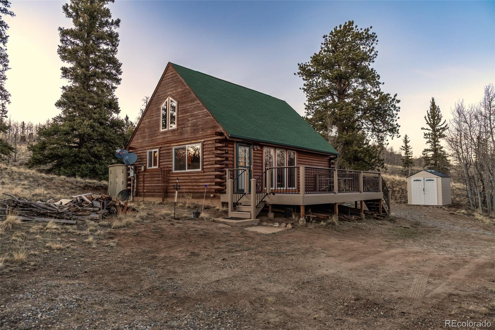 753 Teton Trail Como, CO 80456 - Photo 24 of 32 a backyard of a house with table and chairs