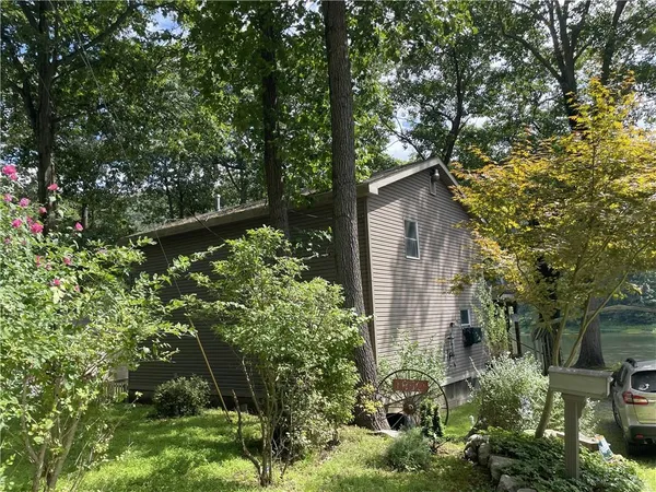 a backyard of a house with lots of green space
