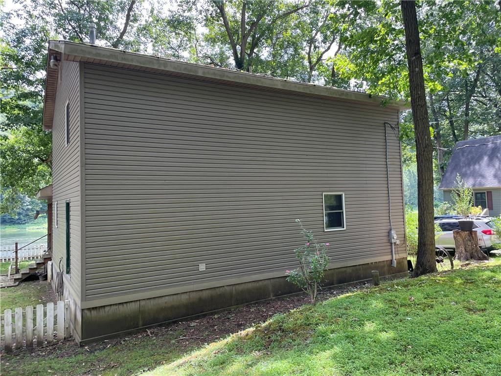 1850 Rockland Station Road Kennerdell, PA 16374 - Photo 6 of 36 a side view of a house with a yard