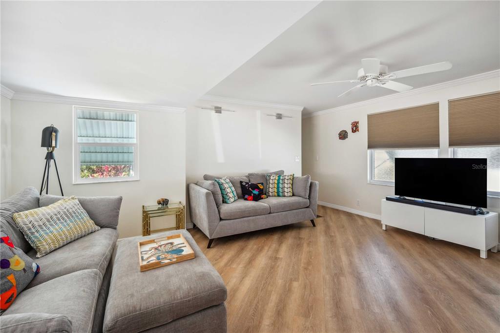 5307 Flint Street Zephyrhills, FL 33542 - Photo 9 of 63 a living room with furniture and a flat screen tv
