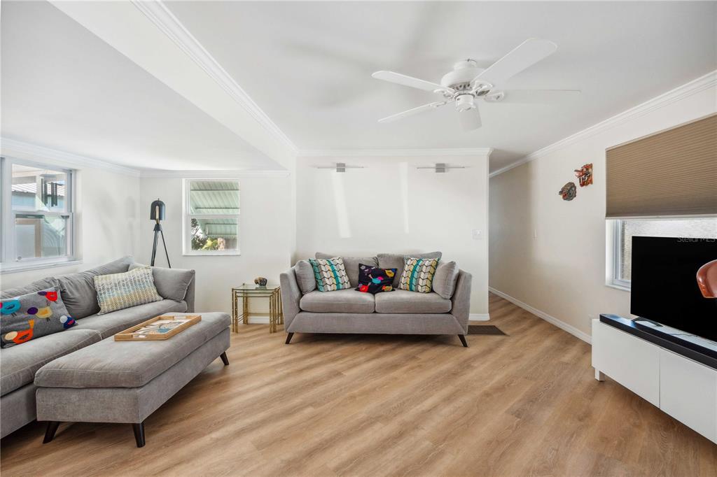 5307 Flint Street Zephyrhills, FL 33542 - Photo 10 of 63 a living room with furniture and a fireplace