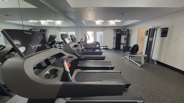 a living room with fireplace furniture and a wooden floor