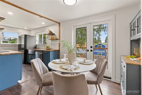 a view of a dining room with furniture window and outside view