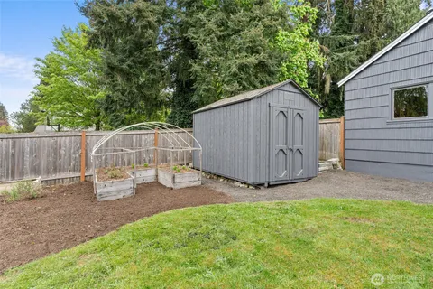 an aerial view of a house with outdoor space