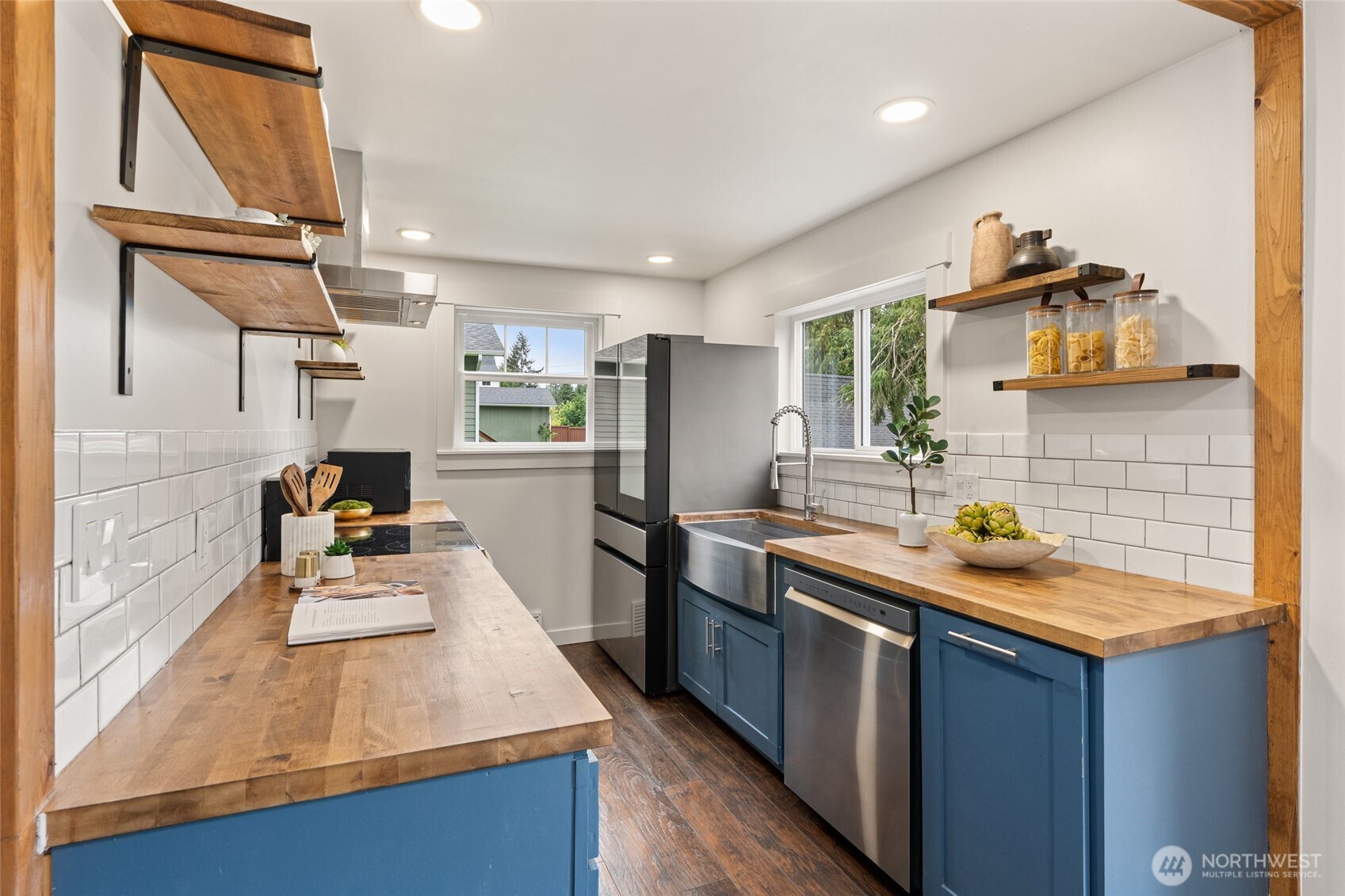 8129 224th Street Southwest Edmonds, WA 98026 - Photo 4 of 27 a kitchen with stainless steel appliances granite countertop a sink stove and refrigerator