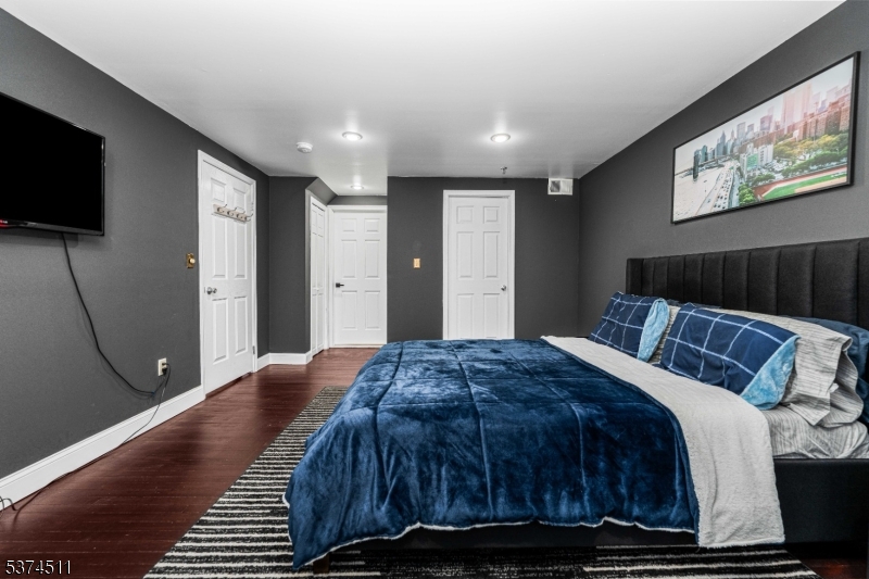 350 Scotland Road Orange, NJ 07050 - Photo 15 of 18 a bedroom with a bed and a flat screen tv