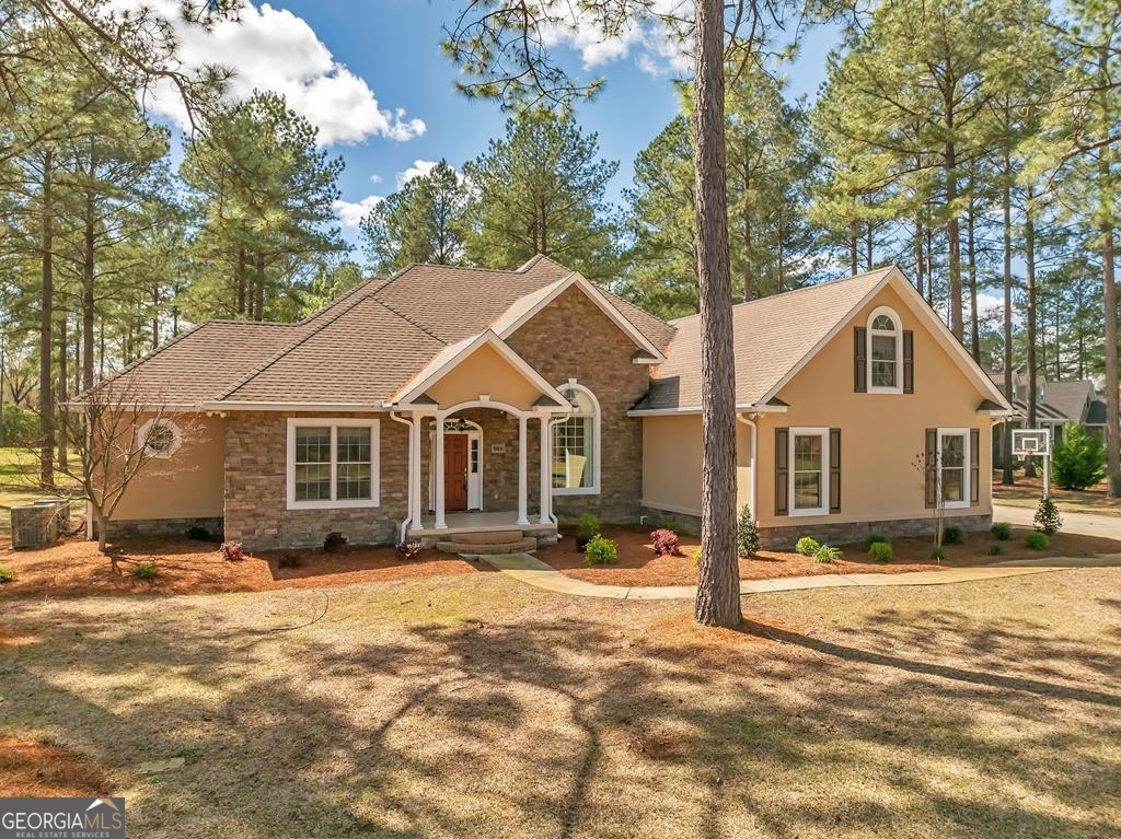 a view of a large house with a yard covered with snow in the outdoor space