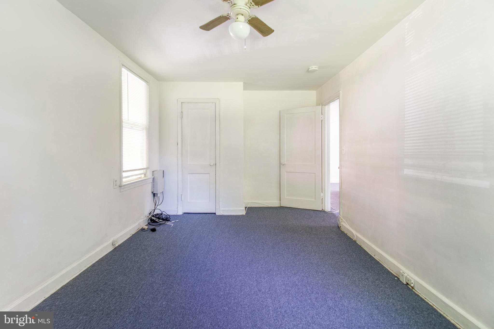 6120 41st Avenue, Unit 1 Hyattsville, MD 20782 - Photo 11 of 28 wooden floor in an empty room with a window