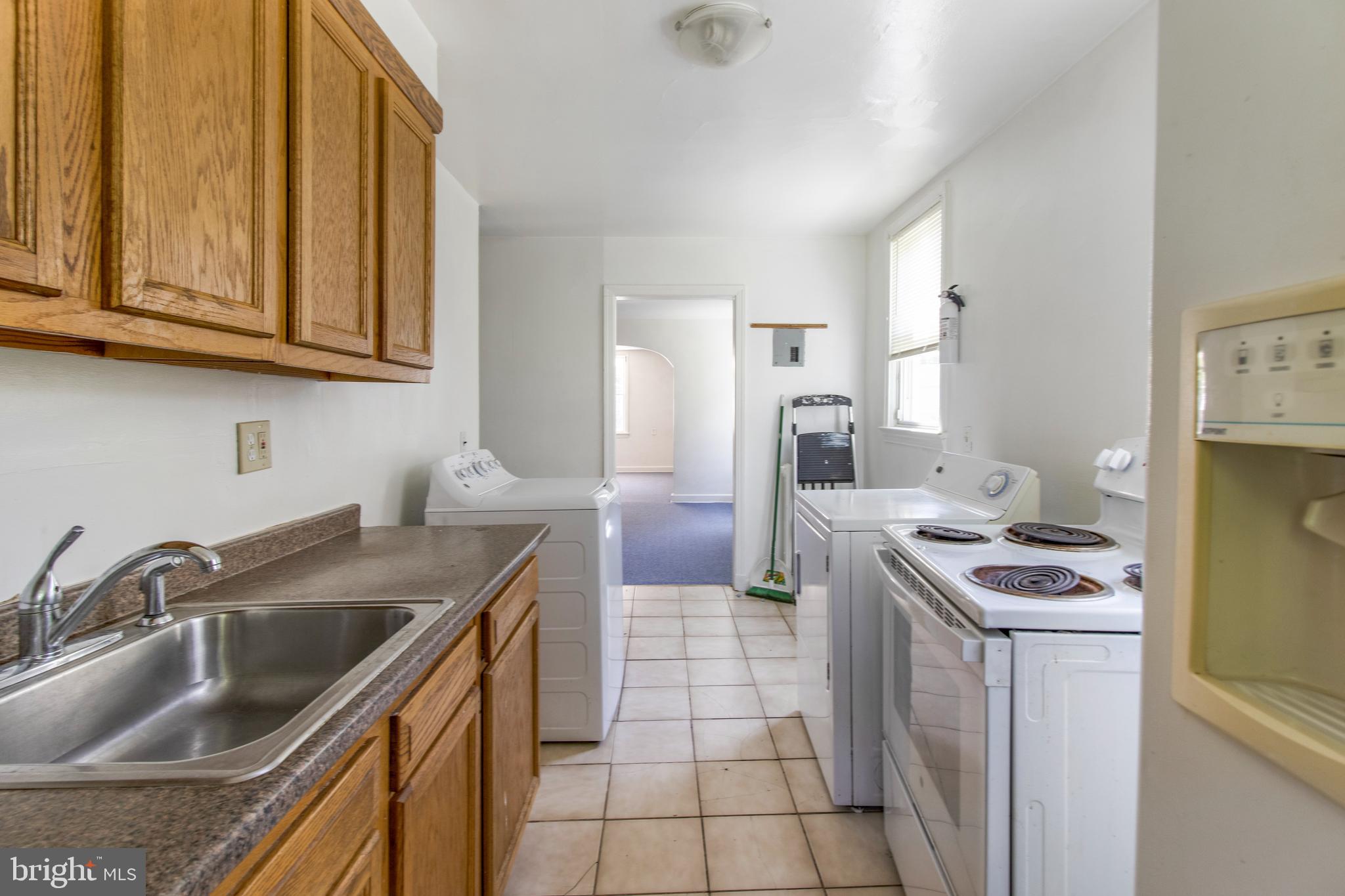 6120 41st Avenue, Unit 1 Hyattsville, MD 20782 - Photo 12 of 28 a kitchen that has a sink and a stove