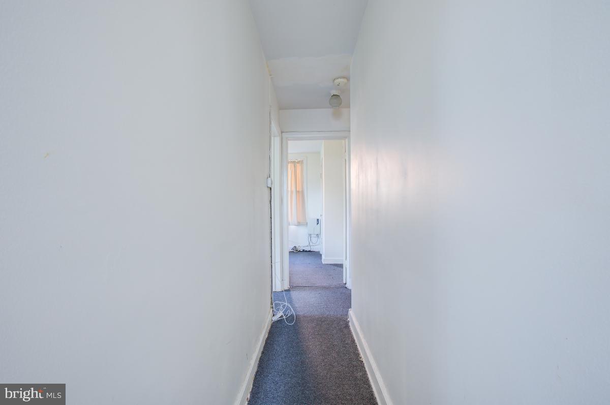 6120 41st Avenue, Unit 1 Hyattsville, MD 20782 - Photo 23 of 28 a view of a hallway with wooden floor