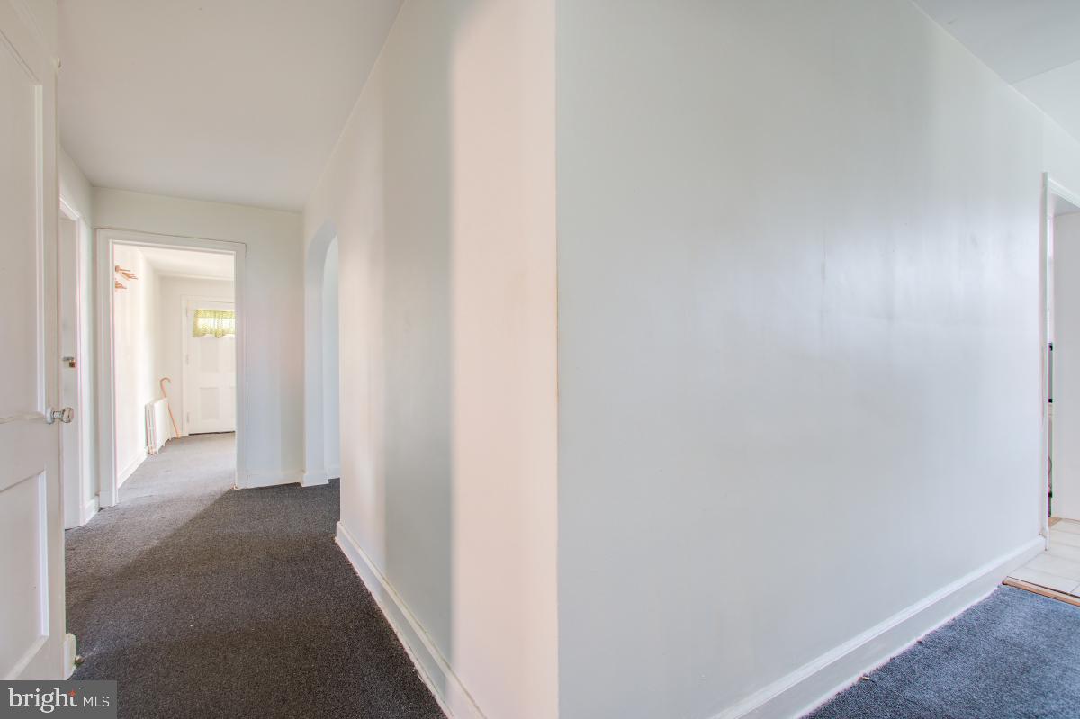 6120 41st Avenue, Unit 1 Hyattsville, MD 20782 - Photo 24 of 28 a view of a hallway with wooden floor