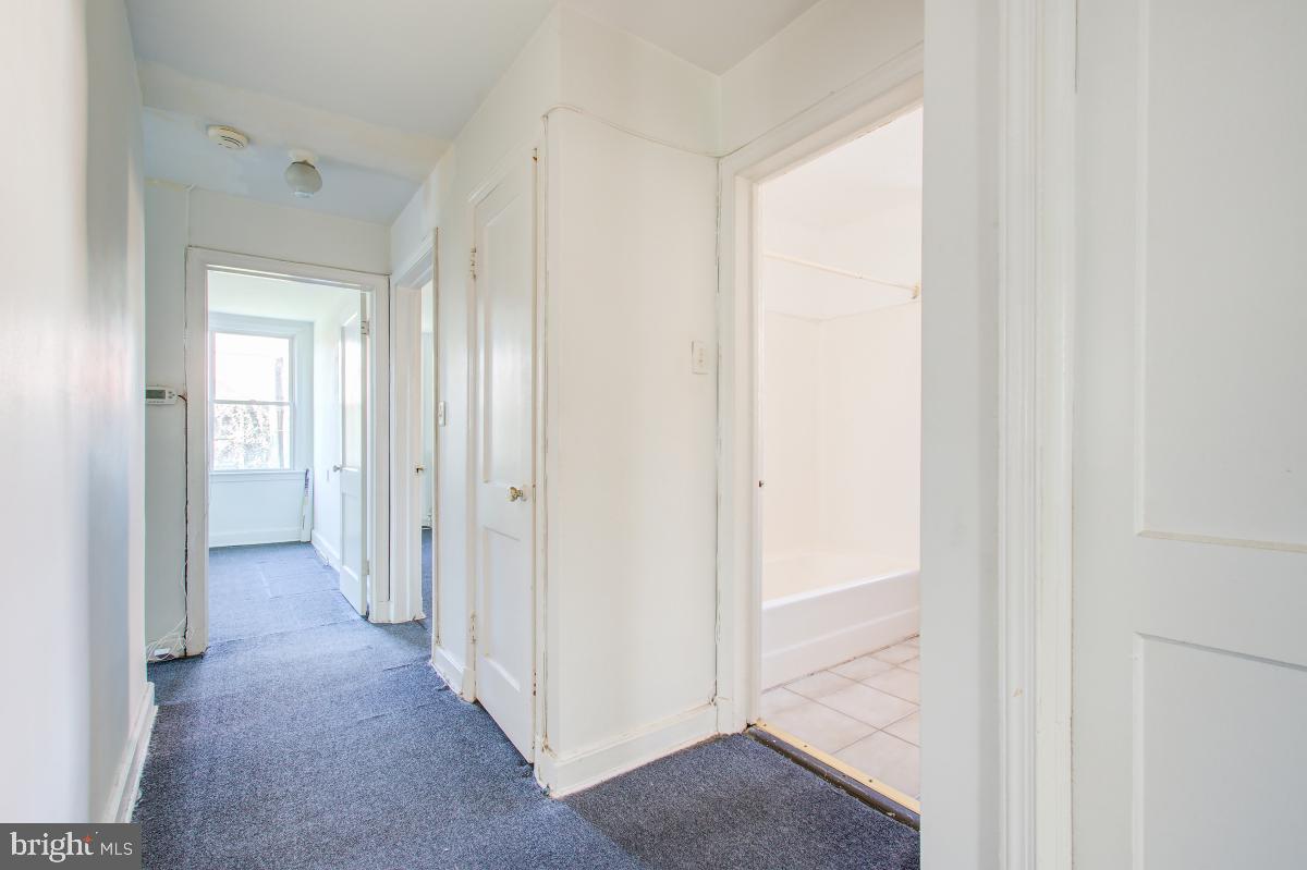 6120 41st Avenue, Unit 1 Hyattsville, MD 20782 - Photo 26 of 28 a view of a hallway with wooden floor