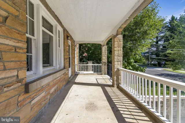 a view of a balcony with wooden floor