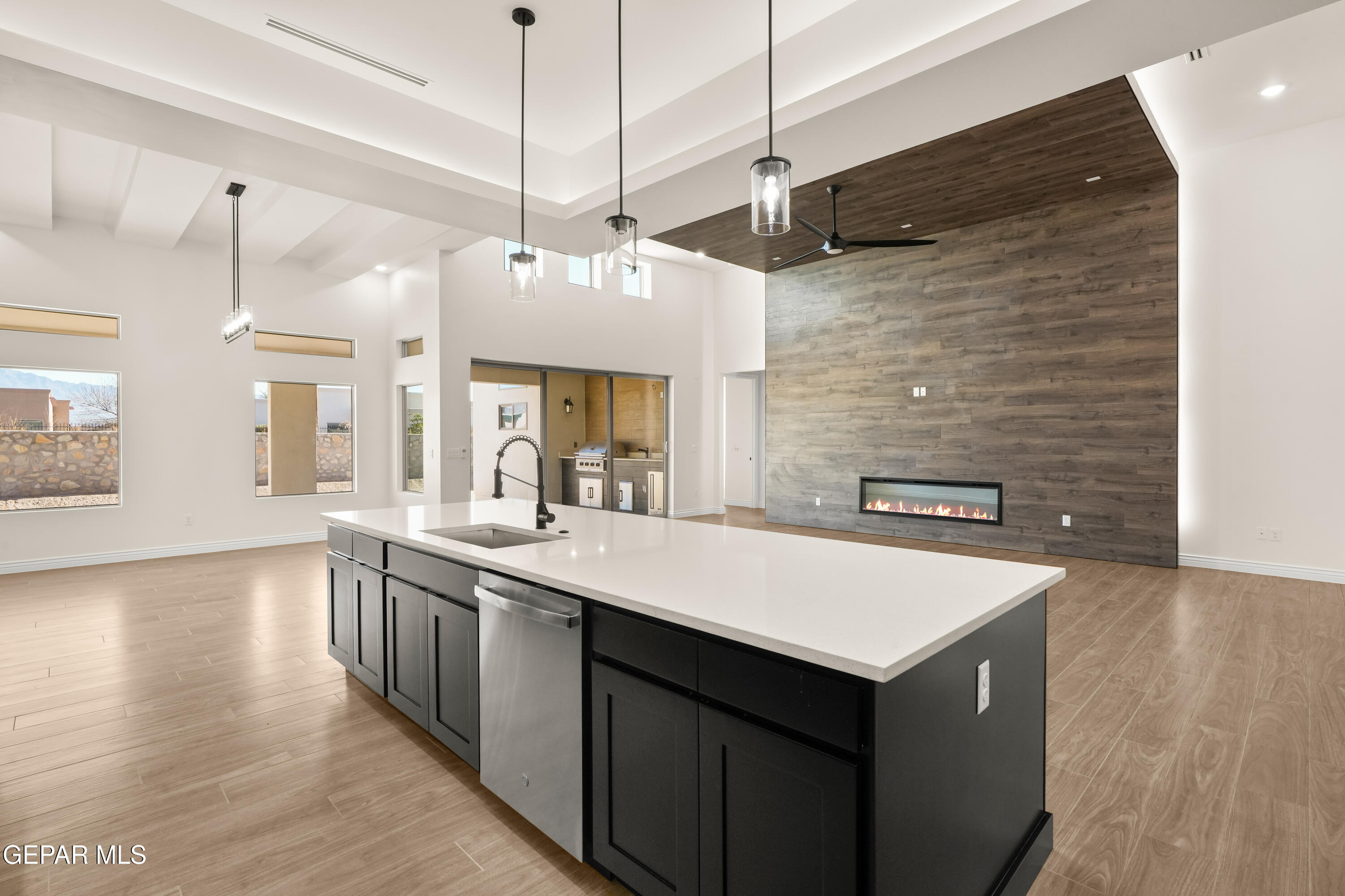 5646 River Run Street El Paso, TX 79932 - Photo 16 of 66 a kitchen with a sink a counter space and wooden floor
