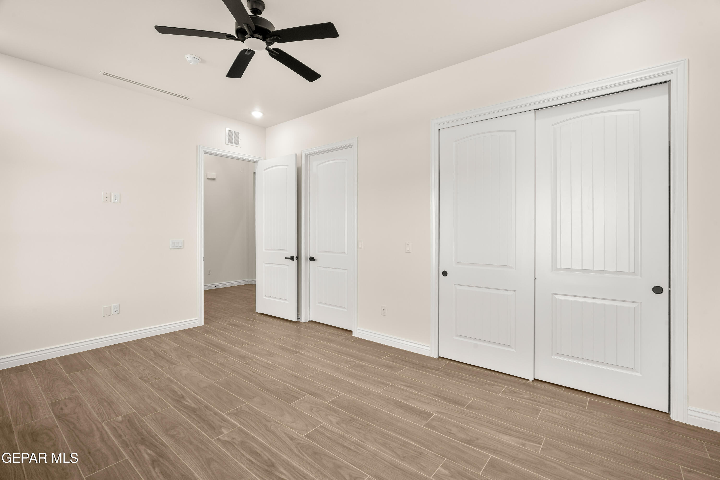 5646 River Run Street El Paso, TX 79932 - Photo 19 of 66 a view of an empty room and wooden floor