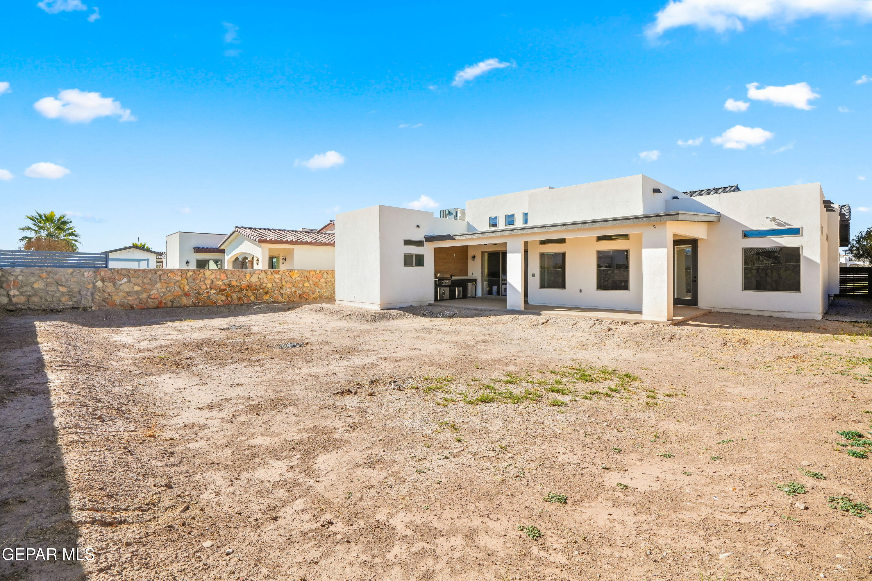 5646 River Run Street El Paso, TX 79932 - Photo 48 of 66 a large white house with a large tree