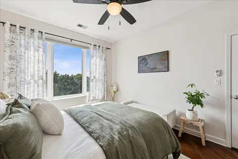 a bathroom with a sink double vanity granite tub shower and a mirror