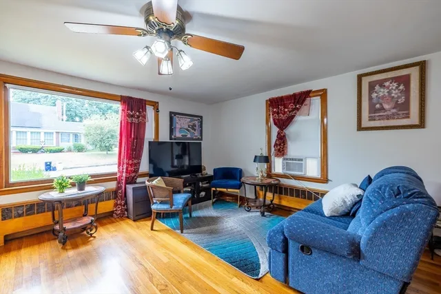 a living room with furniture and a large window