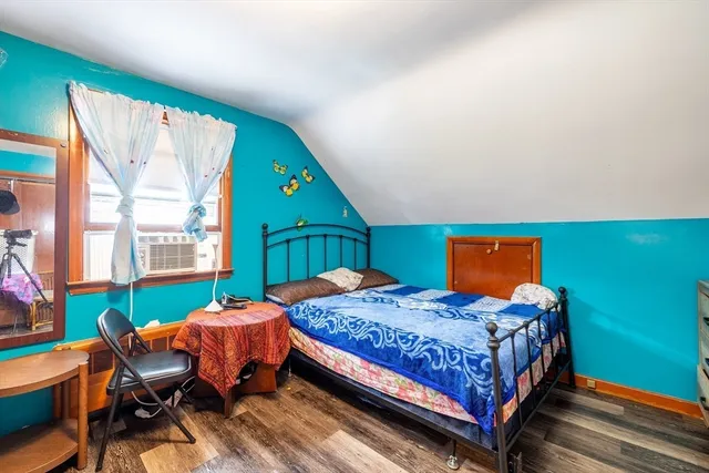 a bedroom with a bed and a table