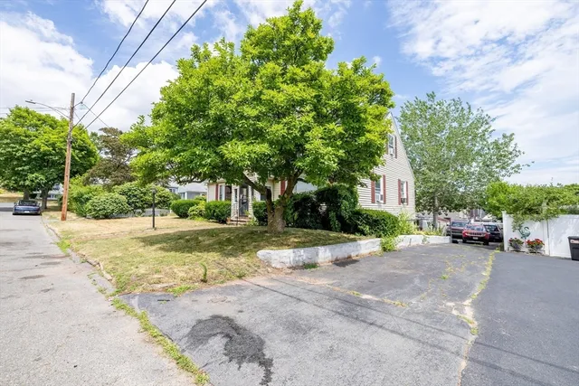 a view of a street with a building in the background