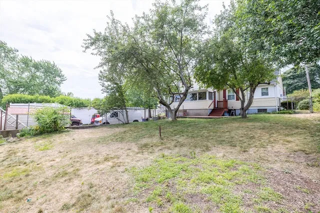 a view of a house with a yard