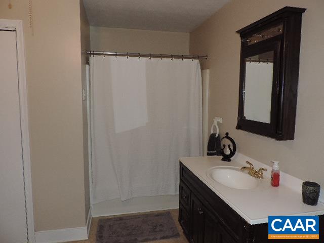 6451 Bell Road Dillwyn, VA 23936 - Photo 12 of 18 a bathroom with a sink and a mirror