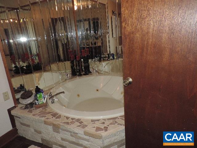 6451 Bell Road Dillwyn, VA 23936 - Photo 9 of 18 a bathroom with a tub and shower