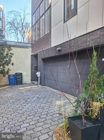 a car parked in front of a brick building
