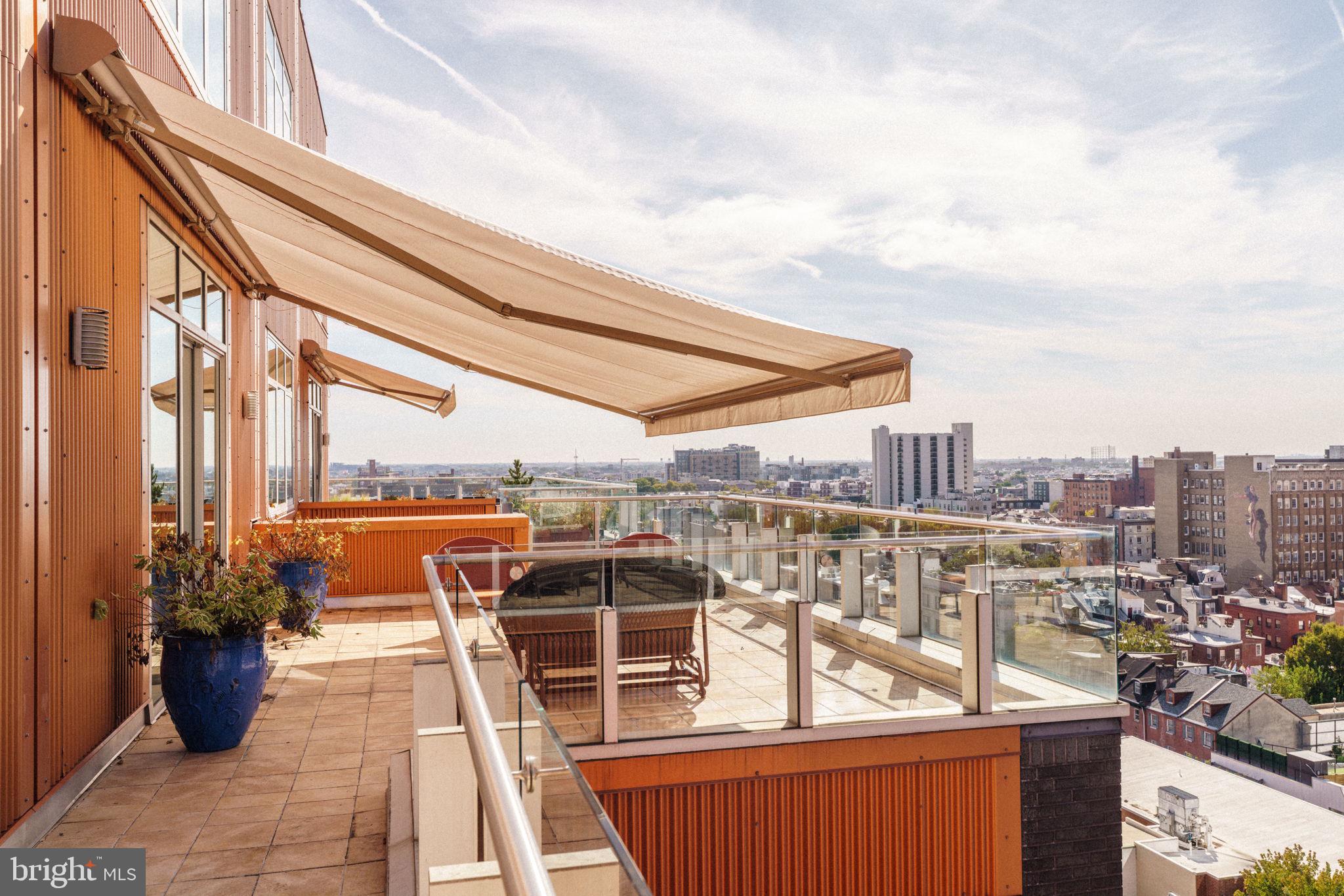 1111 Locust Street, Unit PH10D Philadelphia, PA 19107 - Photo 21 of 31 a view of a balcony with wooden floor and outdoor seating