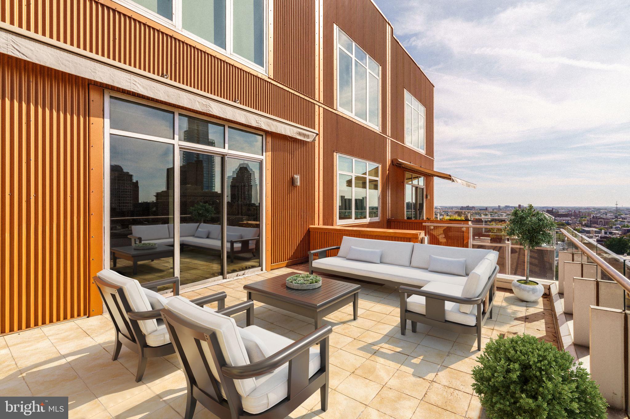 1111 Locust Street, Unit PH10D Philadelphia, PA 19107 - Photo 4 of 31 a view of a patio with a table and chairs