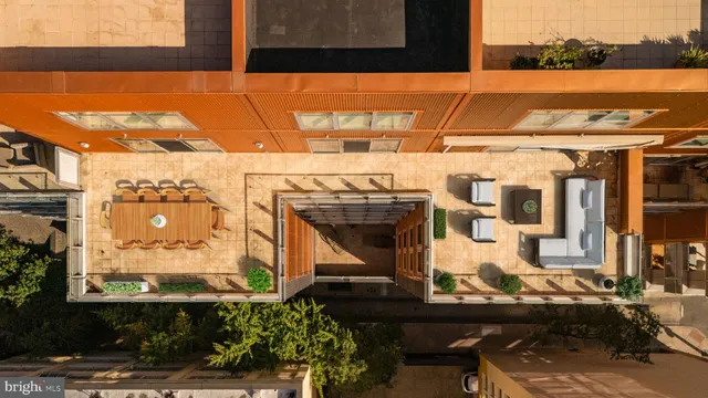 a front view of a building with outdoor seating