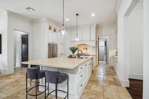 a kitchen with a table and chairs in it