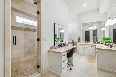 a bathroom with a sink vanity toilet and shower